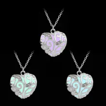 Detailed view of heart-shaped luminous necklaces glowing in purple, cyan, and light blue