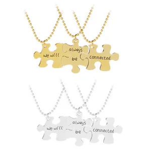 Detail of puzzle piece pendant set with we will always be connected engraving