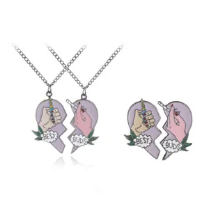 Macro detail of best friends heart puzzle pendant with Best Buds cartoon graphics
