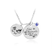 Detailed shot of silver chain with unicorn and inspirational quote pendant and purple bead