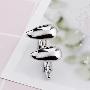 Polished silver teardrop cufflinks for men with a mirror finish on a decorative card