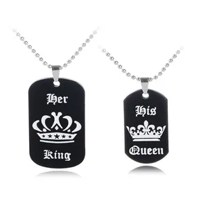 Detail of Her King and His Queen dog tag pendants with crown engravings and ball chains