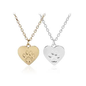 Minimalist heart pendant necklace with paw print engraving in gold and silver finish