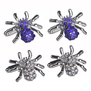 Spin manchetknopen set met blauwe en witte kristallen op een zilveren metalen basis