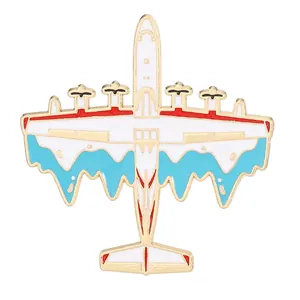 Vintage airplane alloy brooch with white and blue enamel and gold plated edges