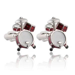 Detailed view of creative drum kit cufflinks with red enamel inlay on silver metal finish