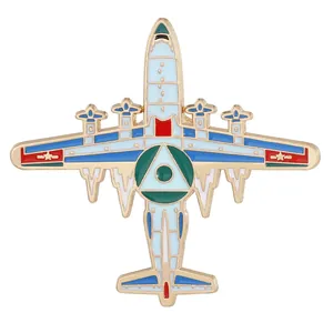 Detail of four-engine military bomber aircraft enamel pin with colorful alloy finish