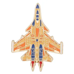 Detail of colorful enamel fighter jet lapel pin with intricate gold metal outlines