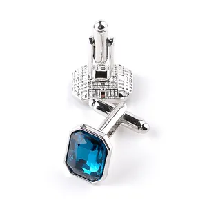 Elegant men's silver cufflinks with rectangular blue crystal inlays on white background