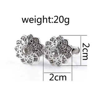 Elegant silver flower cufflinks with sparkling crystals and a layered hollow petal design