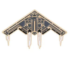 Modern stealth bomber aircraft pin in gold finish with dark grey enamel detailing