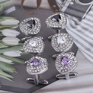 Three pairs of elegant heart shaped cufflinks in black, white, and purple crystal stones