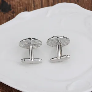 Elegant silver round cuff links for men featuring a T-bar back and textured metal finish