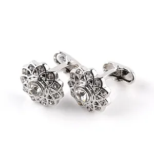 Silver round mandala cufflinks with sparkling crystals and a central clear gemstone