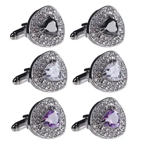 Three pairs of heart-shaped cufflinks with black, white and purple crystals in silver finish
