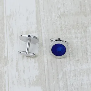 Classic silver-toned men's round cufflinks with deep blue sunburst texture