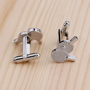 Creative silver table tennis paddle cufflinks for men's shirts featuring textured detailing