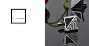 Macro detail of square silver and black enamel cufflinks with geometric texture