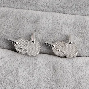 Silver table tennis paddle cufflinks for men made of polished metal in a jewelry box