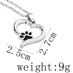 Detail showing heart-shaped dog paw pendant dimensions 2.7cm by 2.5cm on white background