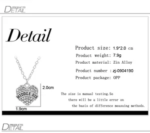 Detailed view of Middle Sis heart pendant with rhinestones and dimensions listed