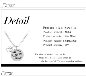 Detail view showing All Paws Matter round pendant and cutout paw charm dimensions