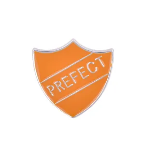 Orange shield-shaped metal badge pin with white PREFECT text and silver metallic border