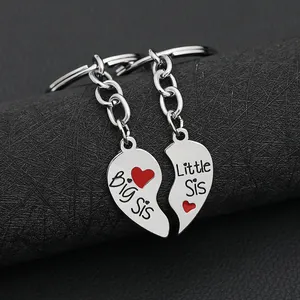 Sisters heart puzzle keychain set with Big Sis and Little Sis engraving in silver finish