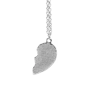 Detailed back view of a silver heart pendant showing fine mesh texture and smooth edges