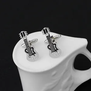 Detailed macro shot of silver electric guitar cufflinks with polished finish and T-bar back