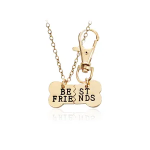 Gouden Best Friends-set met halsketting en sleutelhanger in botvorm en gravure
