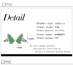 Detailed view of Christmas tree cufflinks with green enamel and colorful rhinestones