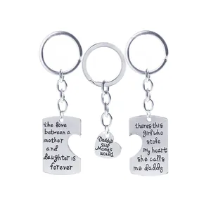 Three-piece family keychain set in polished silver finish with engraved love quotes