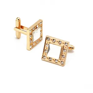 Macro detail of square gold cufflinks with sparkling zircon inlay for men's dress shirts