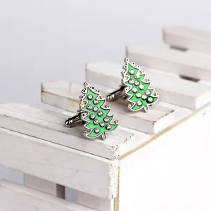 Detail of Christmas tree cufflinks with green enamel and sparkling rhinestones for men