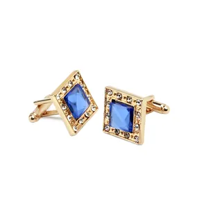 Detailed macro view of square blue zircon cufflinks with gold base and white rhinestones
