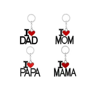 Close-up of metal keychains with I Heart Mom and Dad engraved text and red heart
