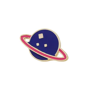 Detail of Saturn-shaped enamel brooch with deep blue body and rose red planetary ring