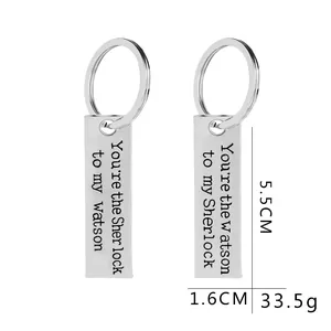 Macro view showing dimensions of Watson and Sherlock engraved couple keychains