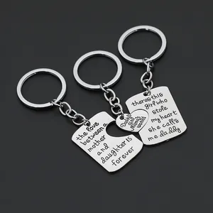 Three-piece puzzle keychain set with engraved family quotes in polished stainless steel