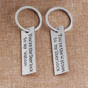 Sherlock and Watson couple keychain set in polished silver finish on rustic background