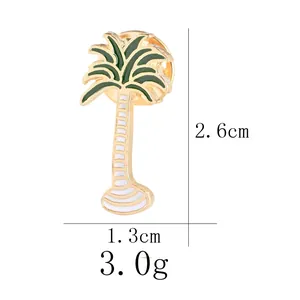 Broche palmier en émail vert et alliage doré avec détails et dimensions précises