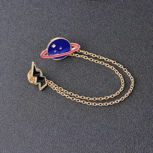 Cartoon enamel planet and lightning pin set with golden double chains on black texture