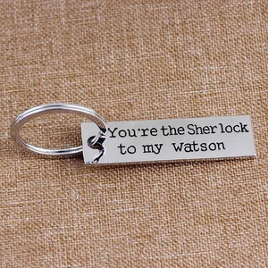 Watson to my Sherlock engraved rectangular alloy keychain on rustic background