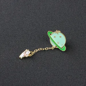 Cartoon enamel brooch set with green planet and cute white rabbit dangling on gold chain