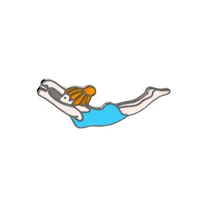 Creative enamel brooch featuring a swimming woman in blue swimsuit and orange swim cap