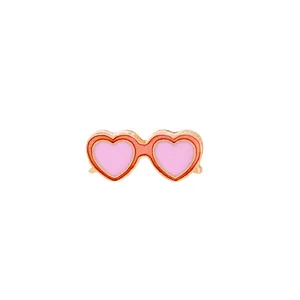 Detail of creative heart sunglasses enamel pin with pink and orange drip oil finish