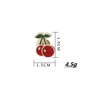 Creative red cherry enamel brooch pin with green leaves and gold trim for summer shirts