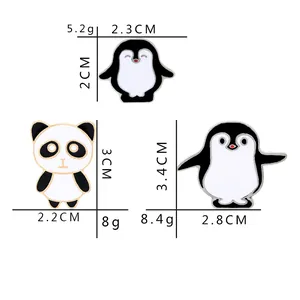 Cute panda and penguin enamel pin set in black and white finish for couple accessories