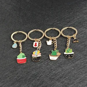 Set of 4 gold zinc alloy succulent cactus keychains with garden tool charms